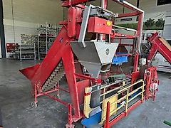 De Lignie afweger, naaiband, O&P palletiseermachine en uitvlakrollen