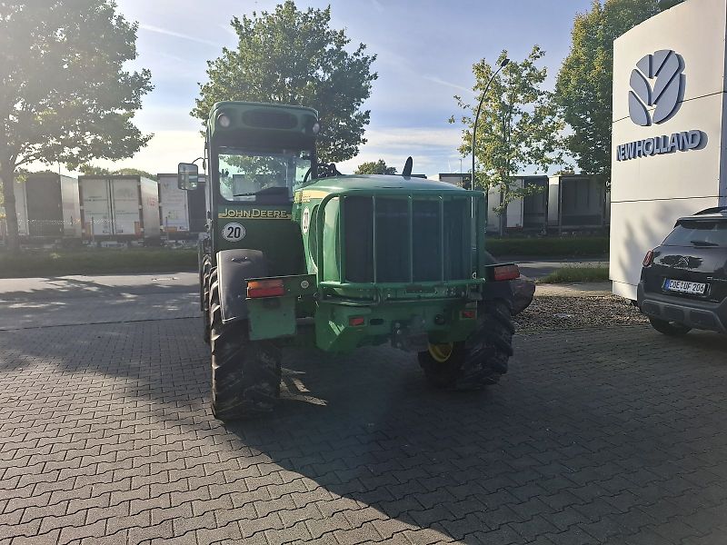 John Deere 3420 mit Schaufel und Palettengabel
